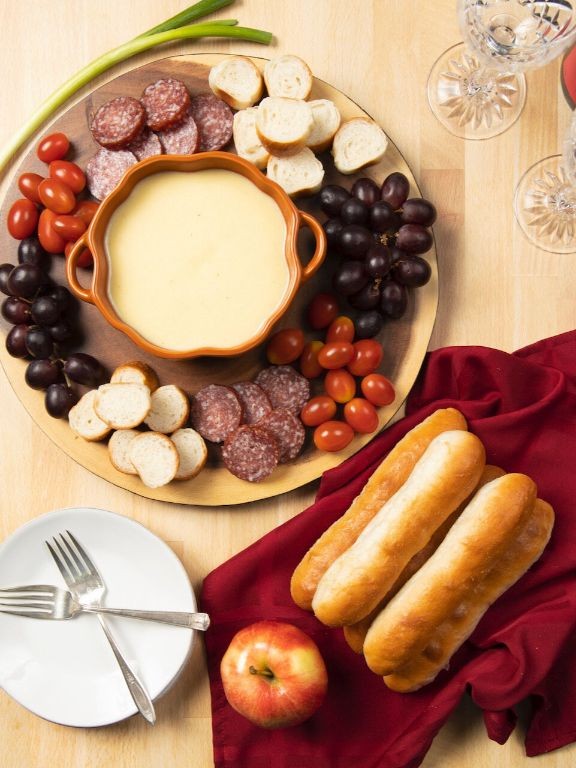 Boiling Cauldron Cheese Fondue with Breadsticks