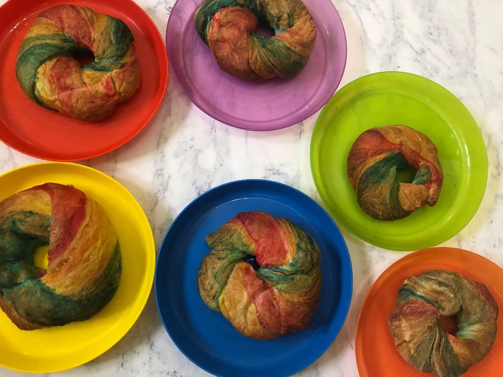 Chocolate Hazelnut Rainbow Bagels with Cocoa Dusting