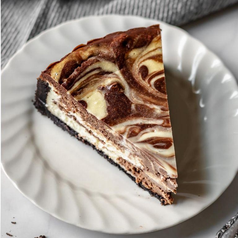Chocolate Marble Cheesecake with Sour Cream Frosting
