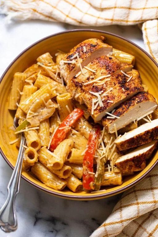 Curry Goat Rasta Pasta with Herbed Cream Sauce