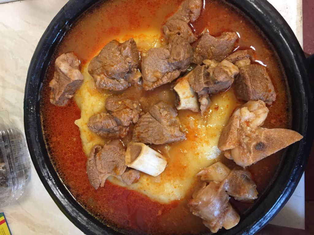 Fufu with Light Soup and Goat Meat