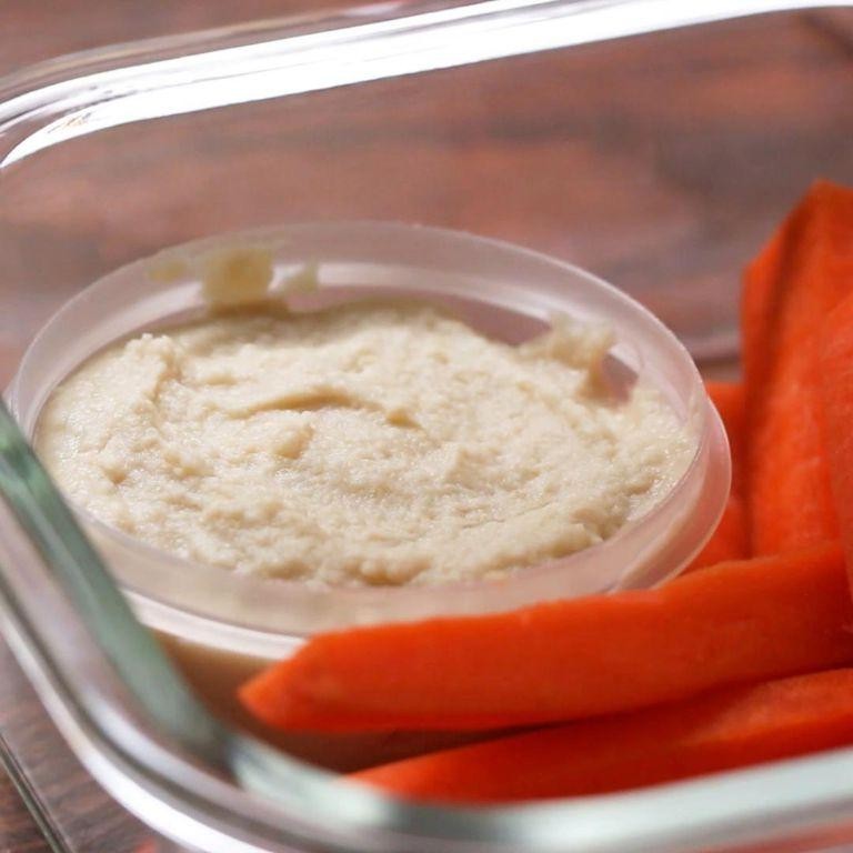 Homemade hummus with carrot sticks