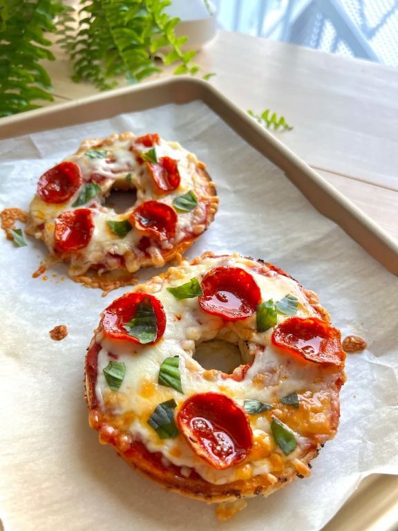 Mini pizza bagels with pepperoni and melted mozzarella
