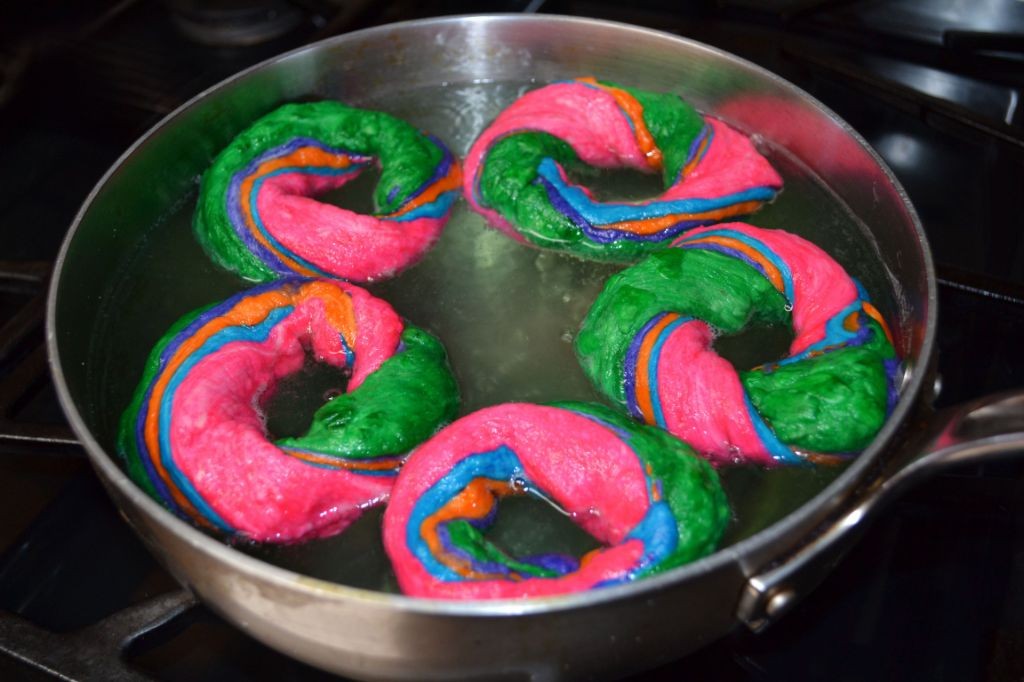 Raspberry Jam-Filled Rainbow Bagels with Powdered Sugar