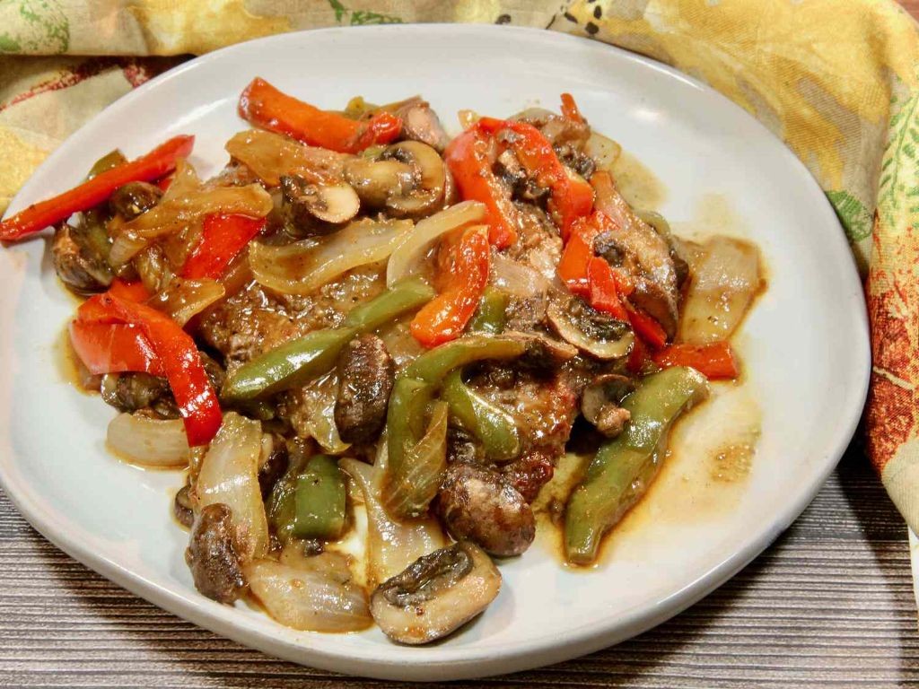 Smothered Pork Cube Steak with Bell Peppers