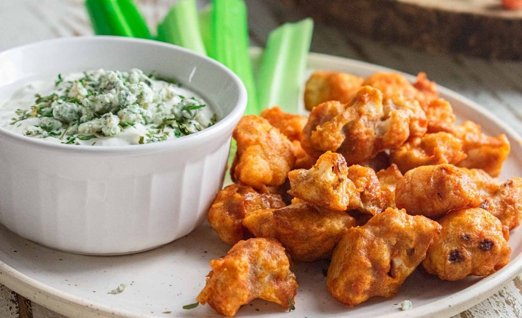 Spicy buffalo cauliflower wings with blue cheese dressing