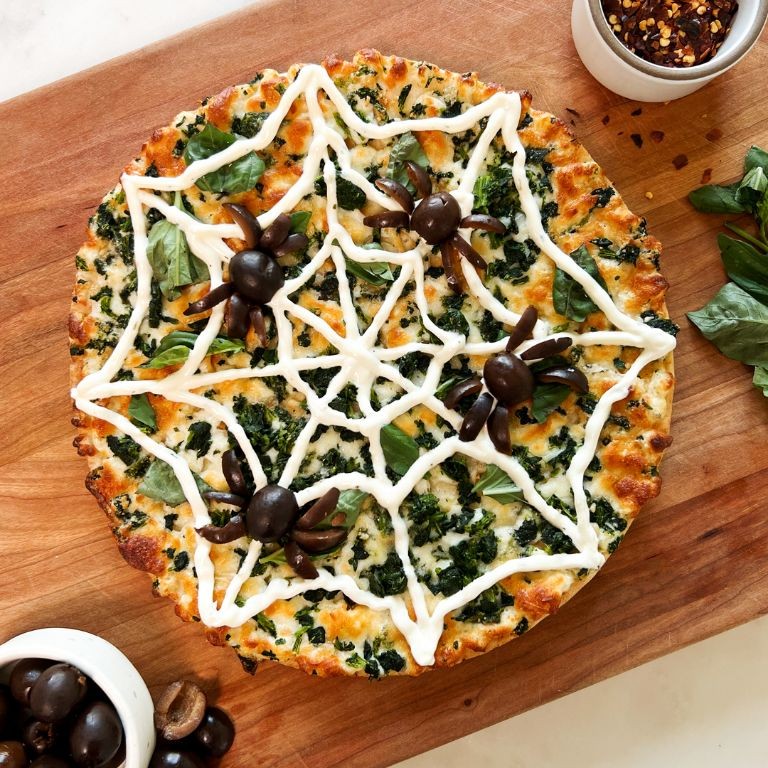 Spiderweb Pizza with Black Olive Garnish