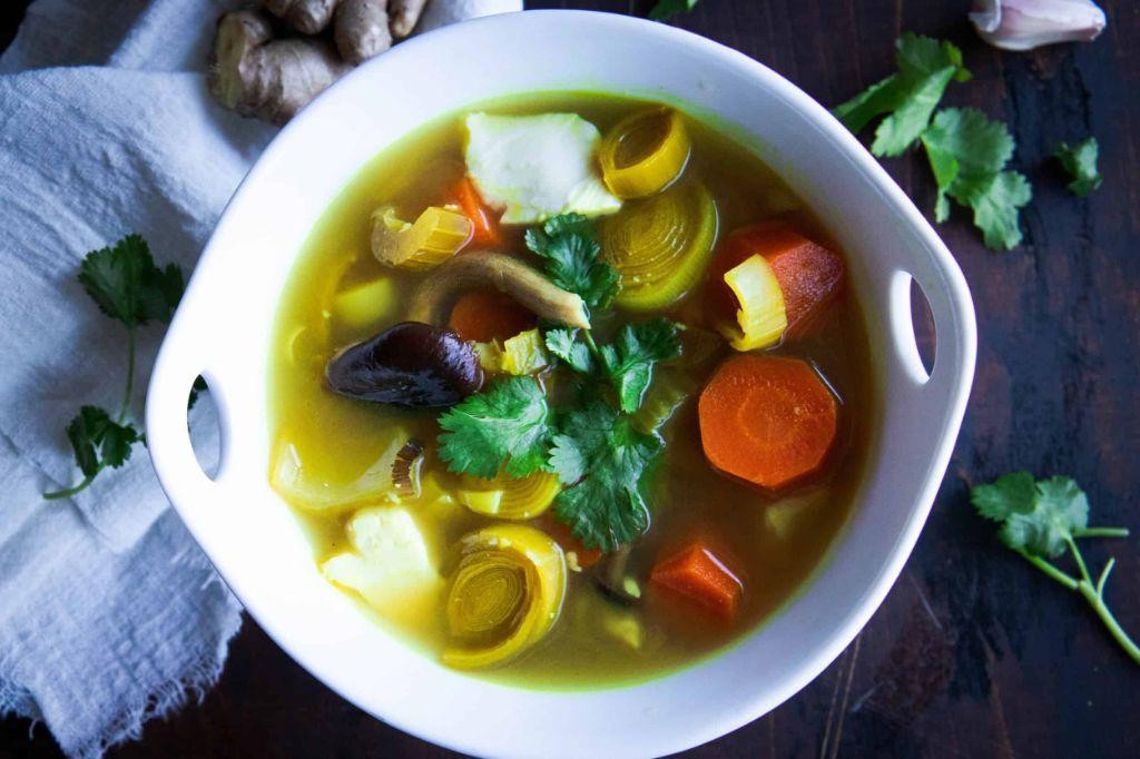 Strained vegetable broth with turmeric