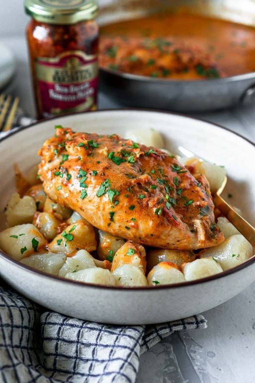Sun-Dried Tomato and Basil Baked Chicken Breast with Pesto Cream Sauce