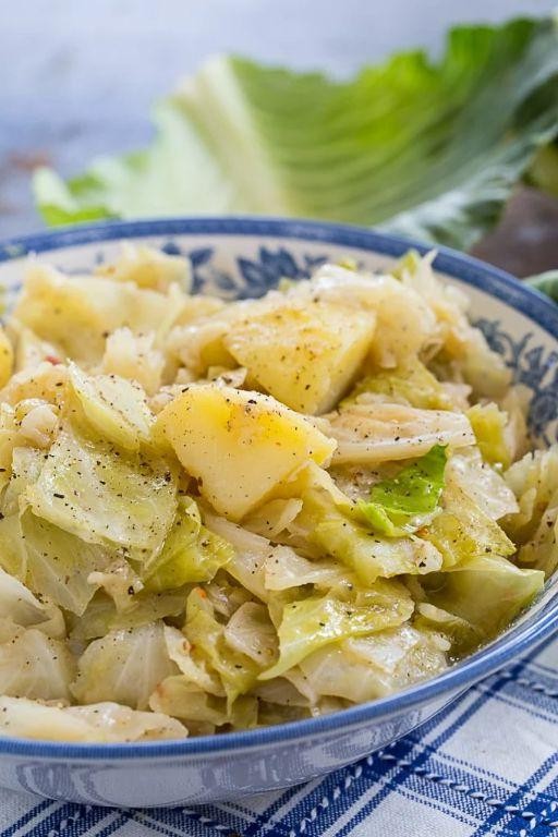 Boiled cabbage and potatoes with herbs