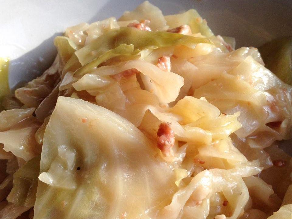 Boiled cabbage with bacon and onions