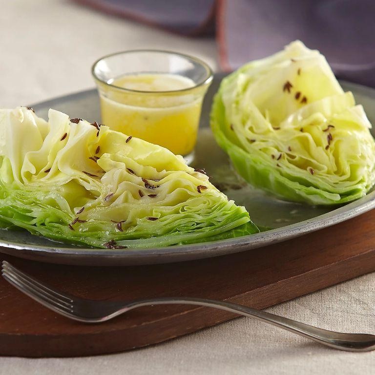 Boiled cabbage with caraway seeds and butter