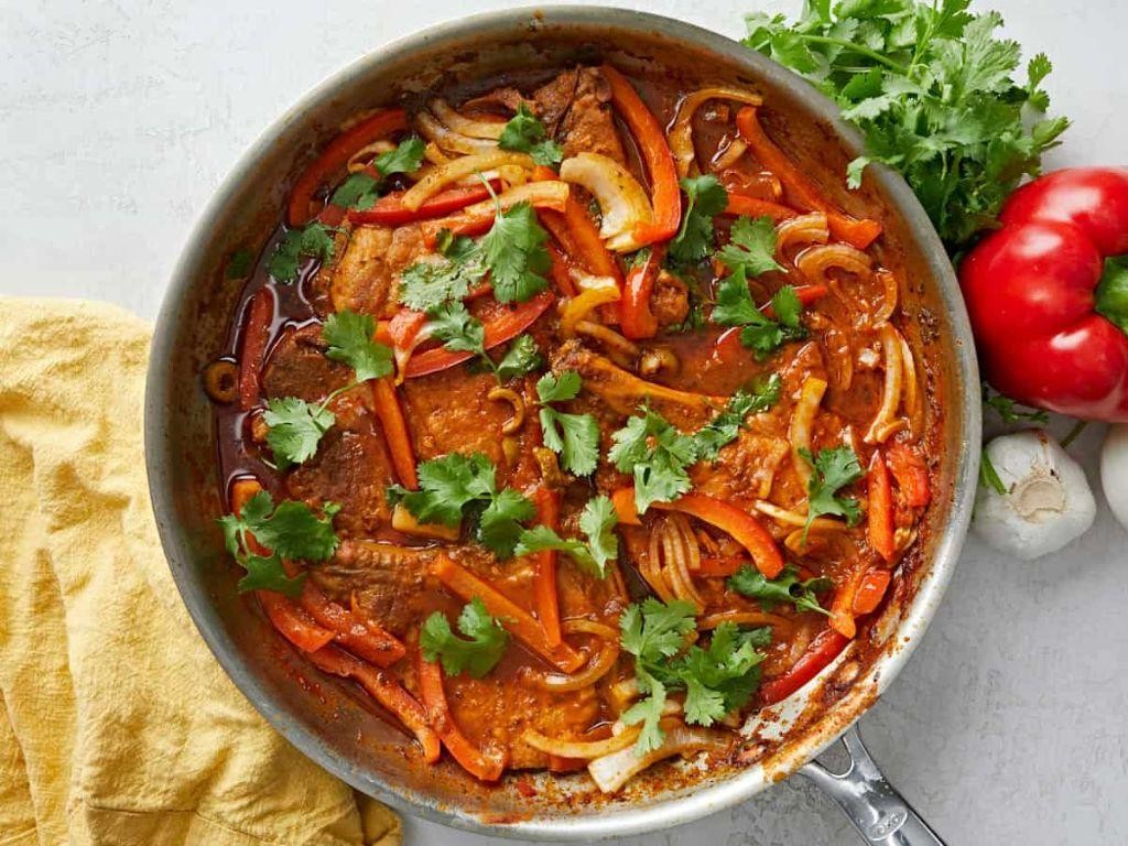 Chuletas Guisadas (Braised Puerto Rican Pork Chops in Tomato Sauce)