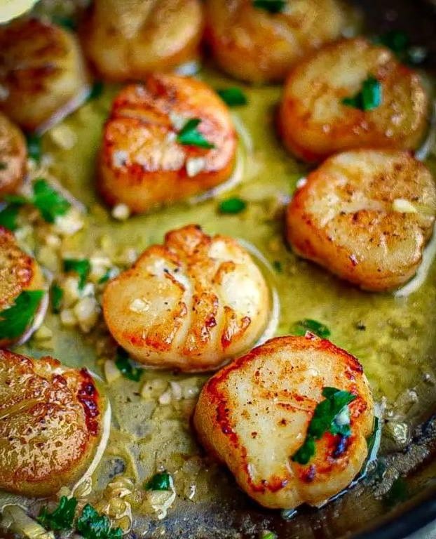 Garlic Butter Scallops over Lemon Grits